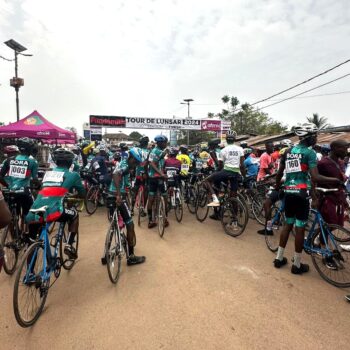 Re-Cycle Bikes to Africa Village Bicycle Project Banner in Sierra Leone Roadside spectators
