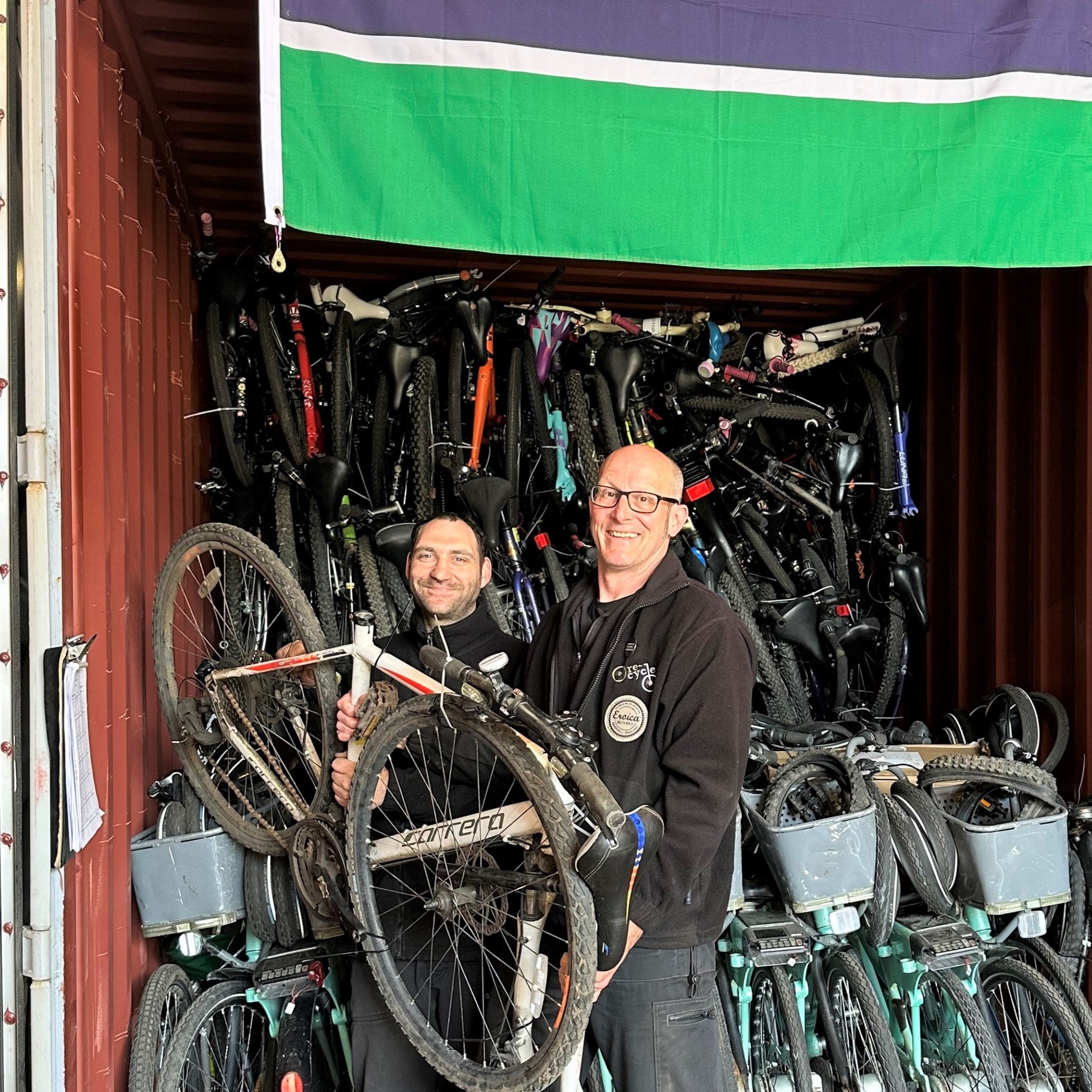 Ryan and Mark warehouse manager at Re-Cycle The Gambia Bike