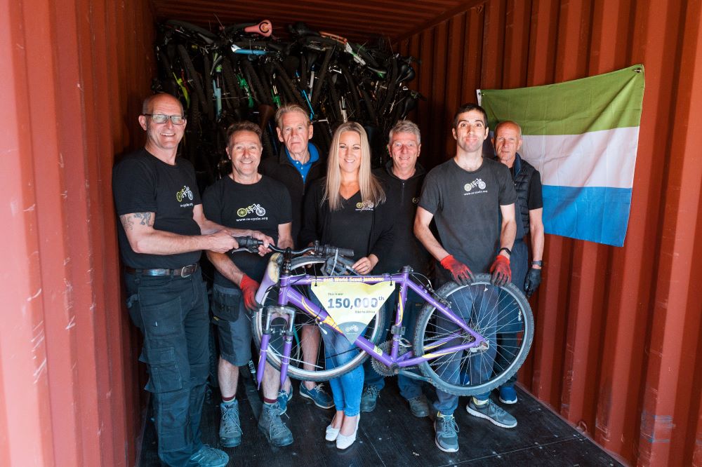 Re-Cycle staff volunteer shipping container