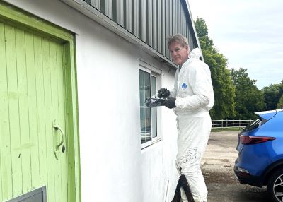 Steve volunteer painting warehouse charity