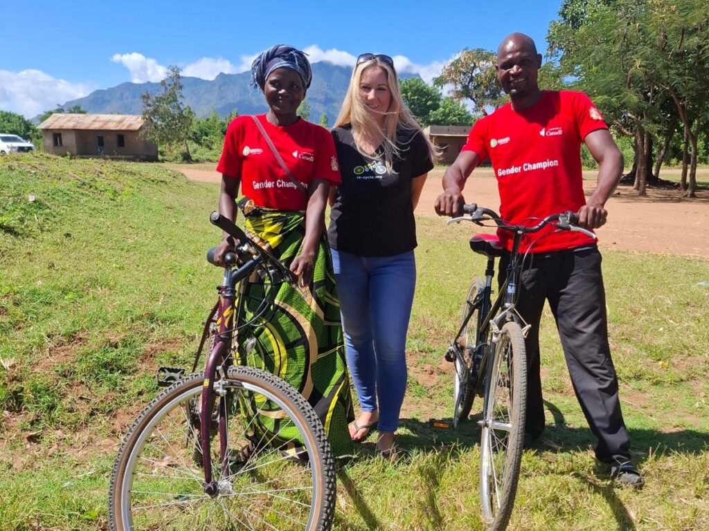 Gender Champions, Stefano and Jennifer with Charlotte Malawi Bikes charity re-cycle