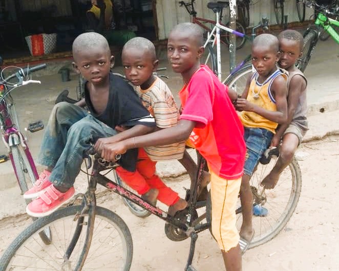 5 kids on a bike in the gambia wyce